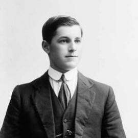 Studio portrait of a young man wearing a suit.  Family name Wedgwood or Wedgewood.
