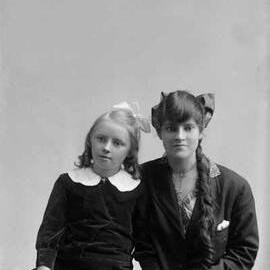Studio portrait of a young woman and a girl.  Family name Stott.