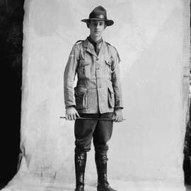 Studio portrait of a young man in an unidentifiable uniform.  Family name Lowe.