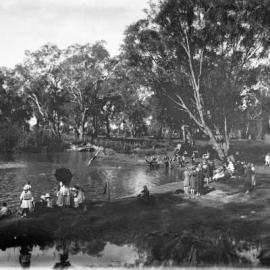 People gathered along the banks of a river, possibly at Benalla.
