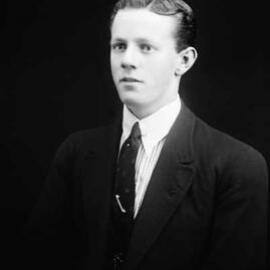 Studio portrait of a young man.  Family name Woodward.