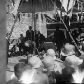 Laying a foundation stone for an unknown building.