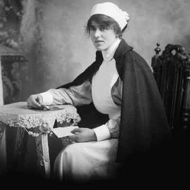 Studio portrait of a woman in a nurse’s uniform.  Family name ‘Cunningham’.