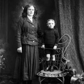 Studio portrait of a woman and a young boy.
