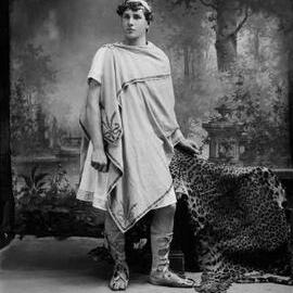 Studio portrait of a young man dressed in a Roman toga. Family name possibly Waller.