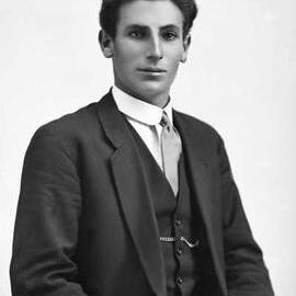 Half-length indoor portrait of a seated young man.    Family name Thwaites.