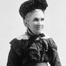 Portrait of  Mrs. Lugg wearing a hat.