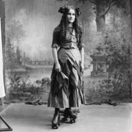 Portrait of Miss Murphy wearing roller skates.