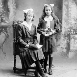 Studio portrait of two young women.   Family name Hendry.
