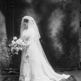 Sudio portrait of Mrs. Joyce in a wedding costume.