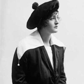 Portrait of a young woman wearing a beret.