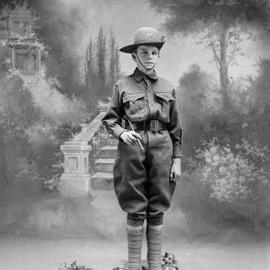 Studio portrait of a young man, family name Cuffe, in a cadet army uniform.