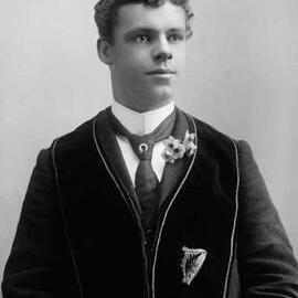 Portrait of Mr. S. Baker wearing a velvet stole or vest of unknown symbolism.