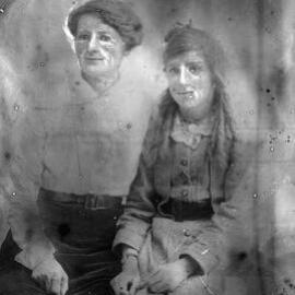 Studio portrait of a seated woman and girl -  family name McInerney.