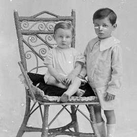 Studio portrait of  two young boys.   Family name Wiltshire.
