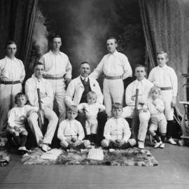 A group of men and boys wearing and holding cricket apparel.