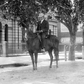 Man on horseback in a Benalla street..