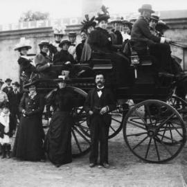 Group of  people gathered around and upon a carriage outside the Campbellfield Hotel.
