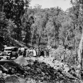 Men and cars on the Tolmie Tourist  Road.