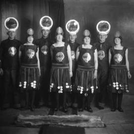 A group of people dressed in ‘Shell Motor Spirit’ costumes.