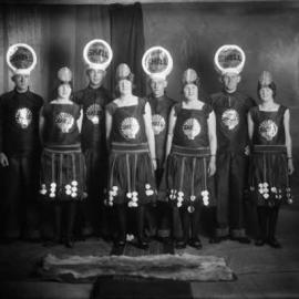 A group of people dressed in ‘Shell Motor Spirit’ costumes.