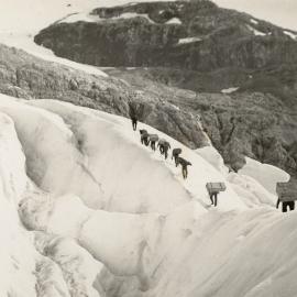 Expedition party walking up a glacier