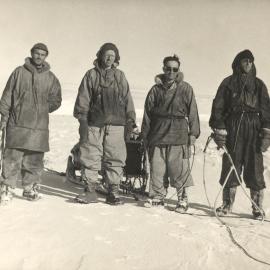 Four men dressed in expedition gear
