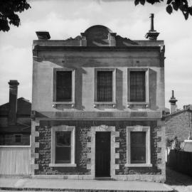 A two storey dwelling in Macarthur Place, Carlton, Victoria.