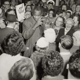 Paul Robeson being welcomed by friends and admirers at a reception in Melbourne in 1960.