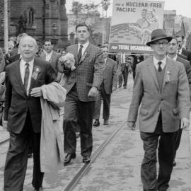 Men parading with banners at a May Day March in Sydney.
