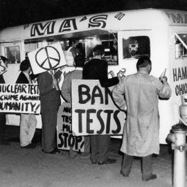 Anti-nuclear test protesters at a take-away food van, during a rally in Melbourne.