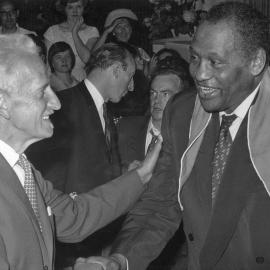 Paul Robeson being greeted in Melbourne by Percy Cerutty in 1960.