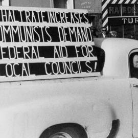 A utility carrying a sign protesting in support of Commonwealth Government aid for municipal councils.