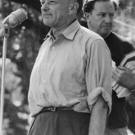 Ralph Gibson speaking at a micropnone with John Arrowsmith.