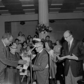 Paul Robeson and his wife being welcomed at a reception in Melbourne in 1960.