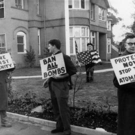 Protesters with anti-nuclear placards outside the United States Consulate, Melbourne, in 1962.