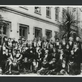 Members of the Princess Ida Club grouped outside the Club Rooms.