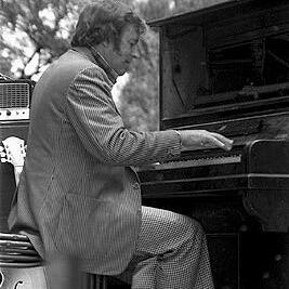 Graeme Bell playing the piano at a jazz concert.