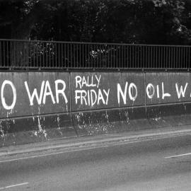 "No war, rally Friday, no oil war" graffiti.