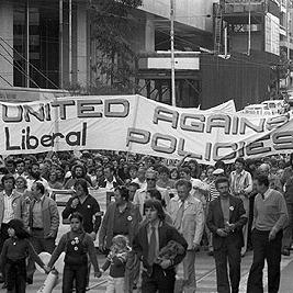 Anti-Fraser government demonstration - "United against Liberal policies" banner.