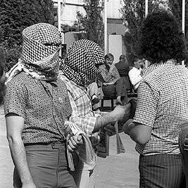 Masked supporters of the Palestine Liberation Organisation (PLO) at the demonstration in the City Square.