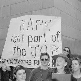 "Rape isn't part of the job, sex workers' rights now" banner at the Prostitutes' Collective demonstration, January 1992.