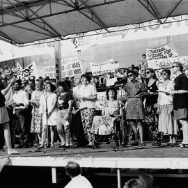 Sian Prior conducting the Victorian Trade Union Choir at the second Persian Gulf war protest march, 25 January 1991.