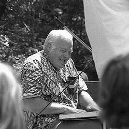 Bill Miller on washboard at a Jazz concert.