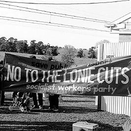 Public transport cuts protest - "No to Lonie cuts" banner.