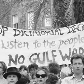"Stop dictatorial decisions, listen to the people, no Gulf war" banner at Persian Gulf war protest march, 18 January 1991.