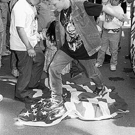 Stamping on American flag at El Salvador march to U.S. consulate offices, November 1990.