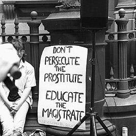 "Don't prosecute the prostitute, educate the magistrate" banner at the Prostitutes' Collective demonstration, January 1992.