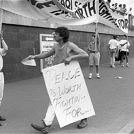 Ultra right-wing supporter holding "Peace is worth fighting for" poster at the second Persian Gulf war protest march, 25 January 1991.