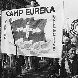 Mark Prosser and Gerry Harant holding Camp Eureka banner at May Day rally, 1991.